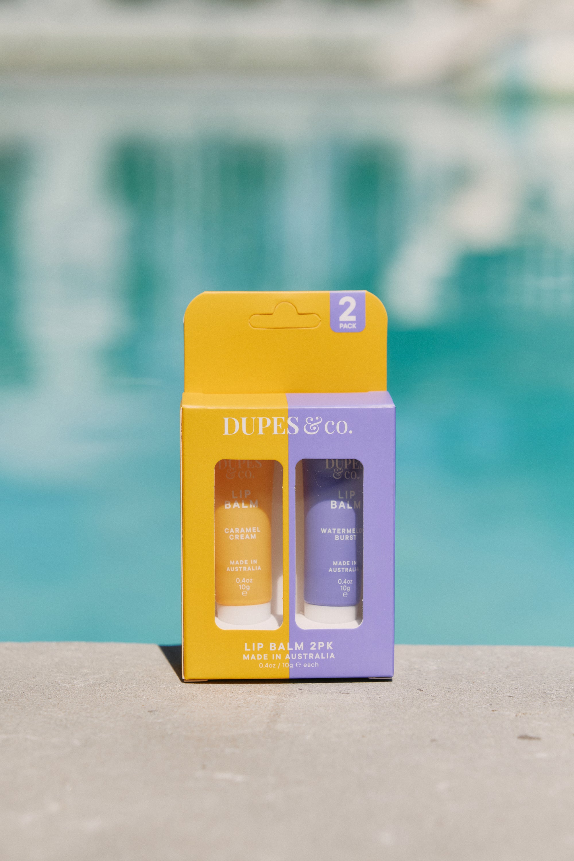 Dupes & Co Caramel Cream and Watermelon Burst Lip Balm 2-pack front view
